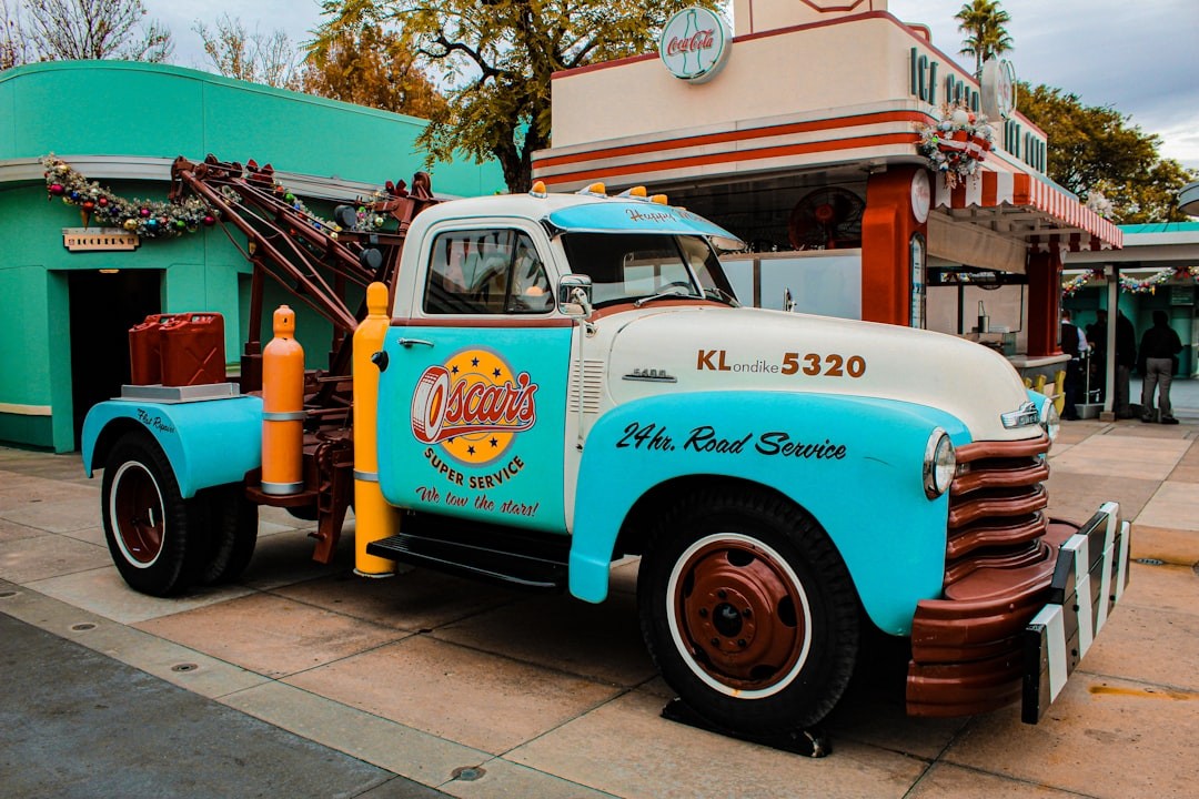 a blue and white truck parked in front of a building